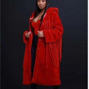 Red long coat brand new size S/M runs like a L. Fringes on coat, includes belt